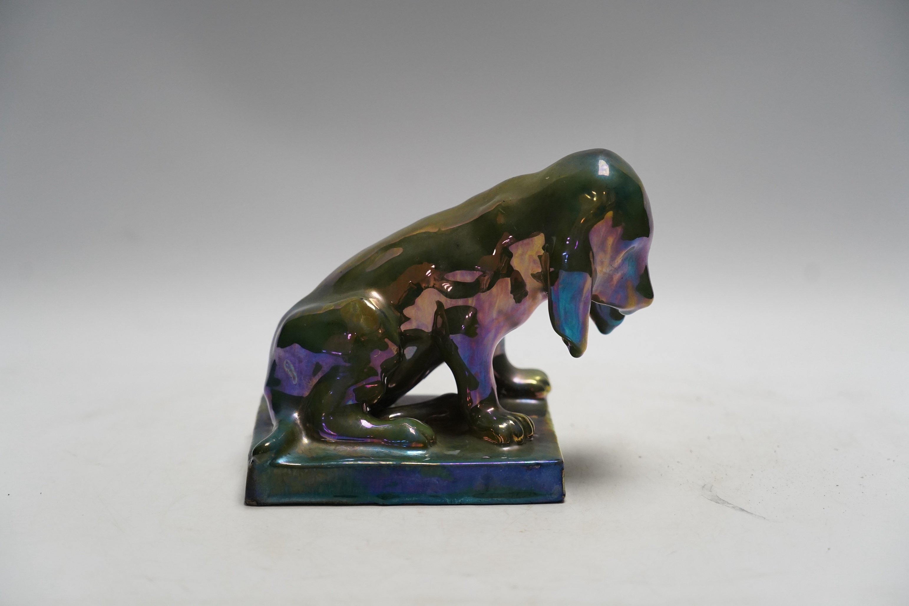 Alphonse Cytere, a French pottery lustre dog, stamped to the base, 18cm wide